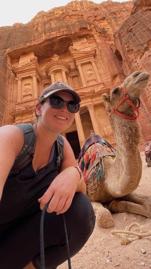 Posing with a camel in front of the treasury in Petra, Jordan