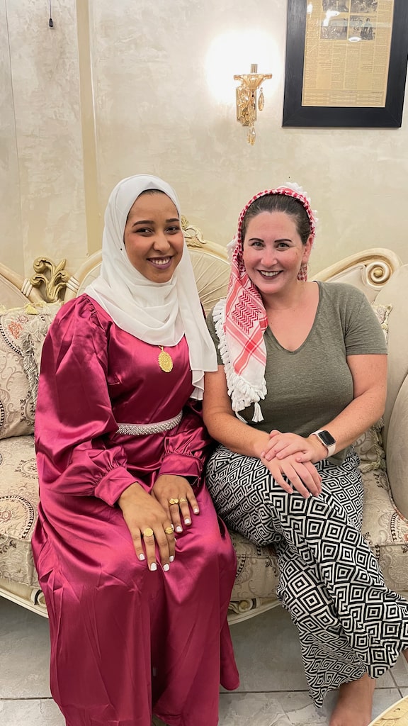 Sitting on an ornate couch with a young Muslim woman, Celebrating Eid Ramadan in Jordan.