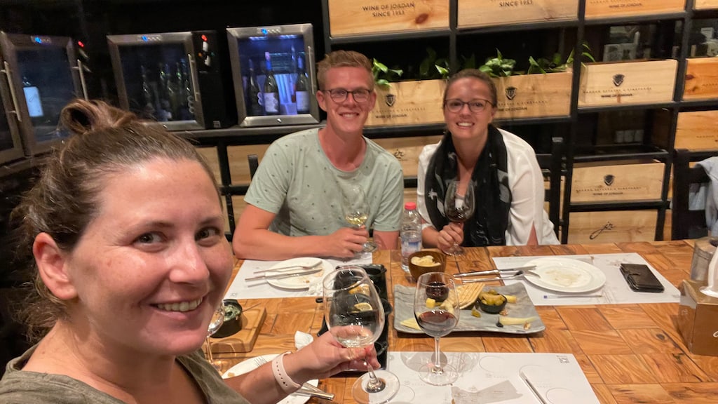 A selfie of me and two newly made friends at a modern wine bar in Amman, Jordan.